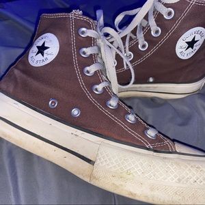 slightly used brown platformed converse
